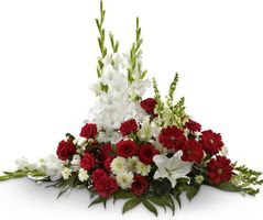 Cuscino funebre di rose, gerbere, gigli o lilium e fiori misti di stag